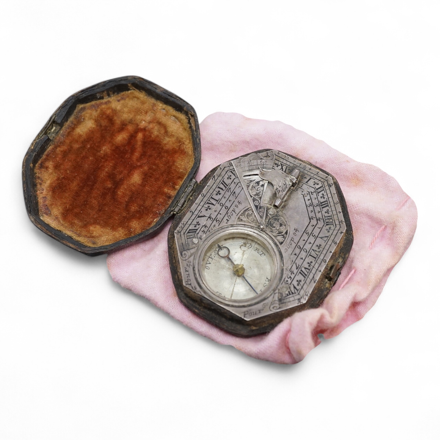 An early 18th century French silvered Butterfield pattern pocket sundial by Bion, Paris, with engraved octagonal plate and the gnomen supported by birds, the reverse engraved with the latitudes of various European cities